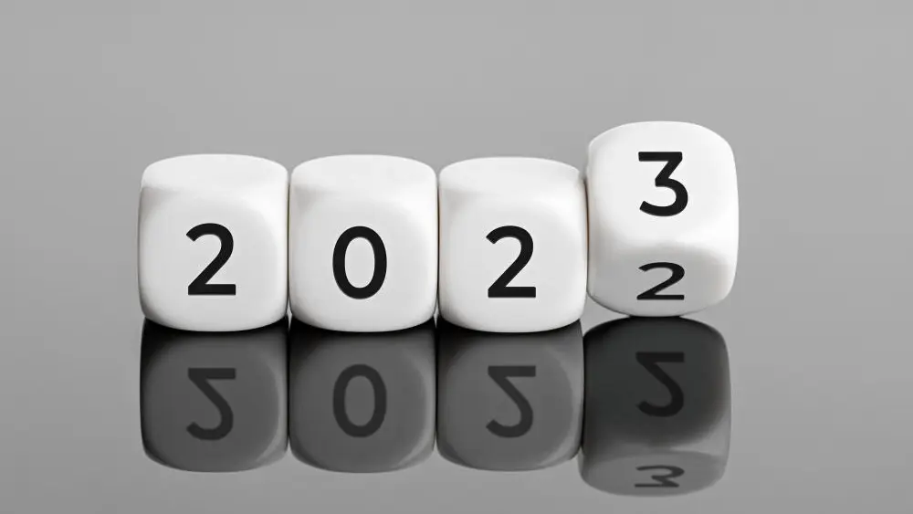 Bürgergeld Ein Symbolbild mit Würfen, dass den Wechsel von 2022 auf 2023 zeigt.