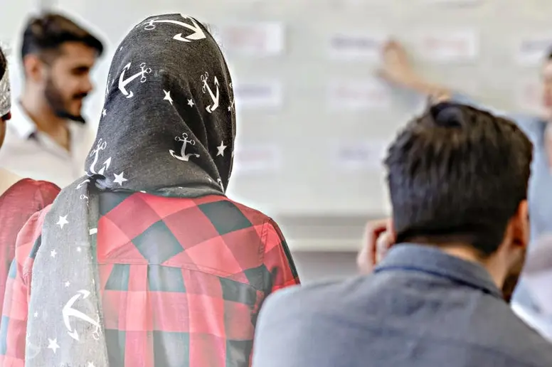Asylbewerber und geduldete Ausländer bei einem Deutschkurs in Hamburg.