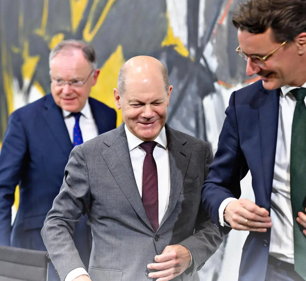 Olaf Scholz, Hendrik Wüst und Stephan weil auf einer Pressekonferenz