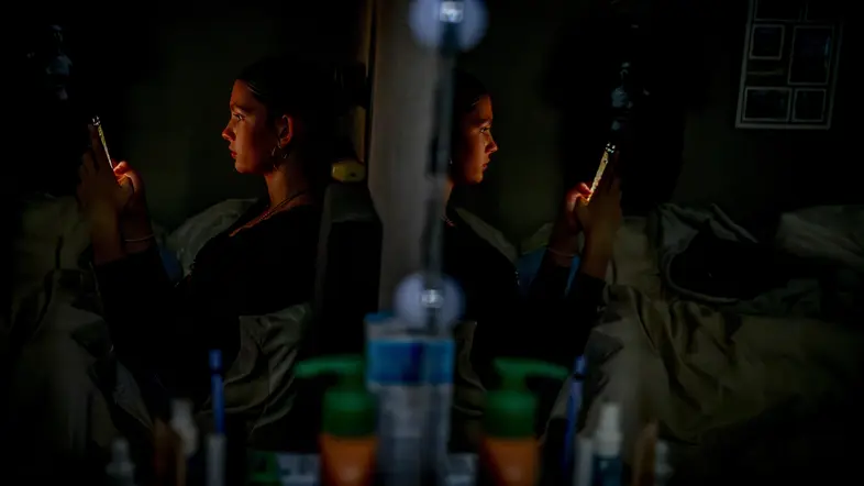 ILLUSTRATIVE - A teenage girl on her mobile phone. A 2014 Maastricht University study found that 70% of young people under 21 are addicted to their mobile phones. More than 1,400 doctors, scientists, and experts are calling on politicians to establish age limits for smartphone and social media use. ROBIN UTRECHT