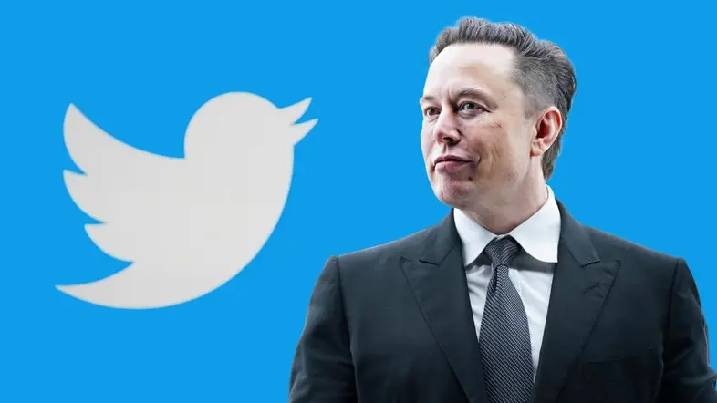 Elon Musk vor einem Twitter-Hintergrund